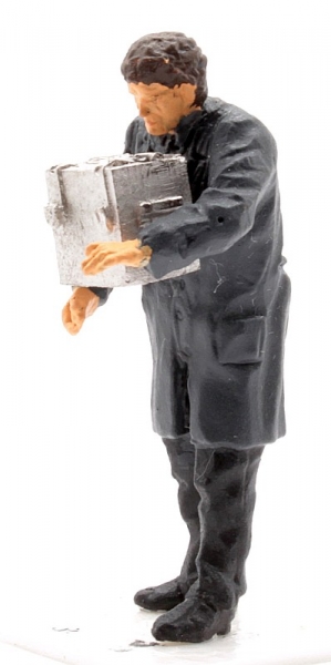 Man in smock putting down box -0-
